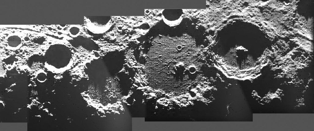 A strip mosaic of spacecraft frames showing large lunar craters and basins lit from one side.