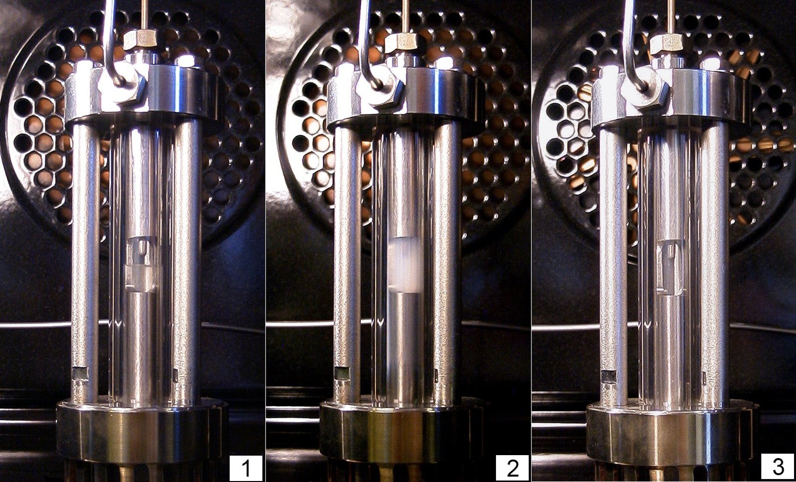 Three photographs of a steel pressure cell holding ethane: the sample is clear, then cloudy, then clear again.