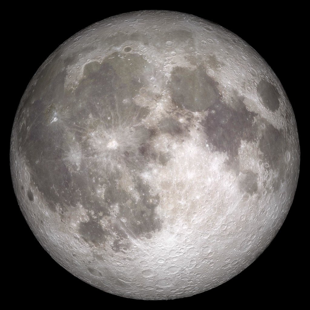 The near side of the Moon at full phase, showing dark volcanic plains and brighter, heavily cratered highlands.
