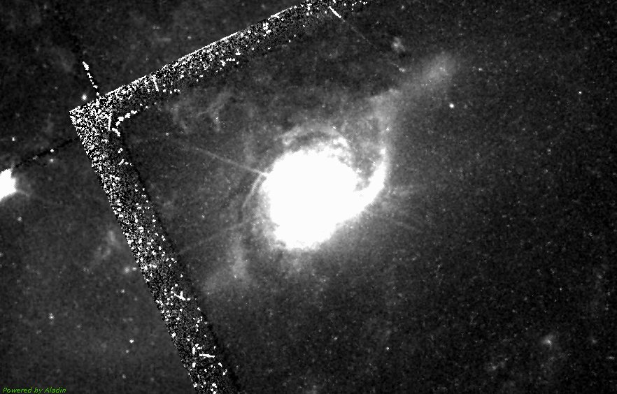 A Hubble frame of the galaxy, its nucleus saturated to a white blaze inside the instrument's stepped field of view.