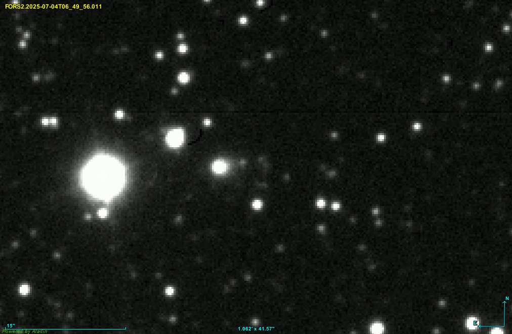 A dense field of white stars on black, with instrument and date text burned in at top left, a scale bar at bottom left and compass arrows at bottom right.